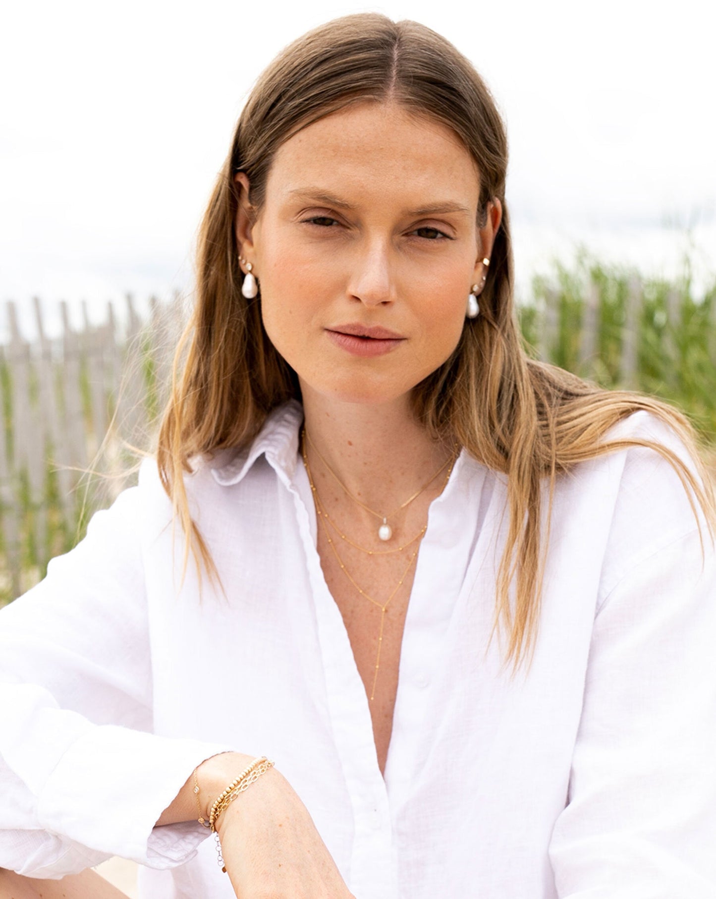 Ring Concierge Earrings 14k White Gold Organic Pearl Earrings - on model with model in white button-down 