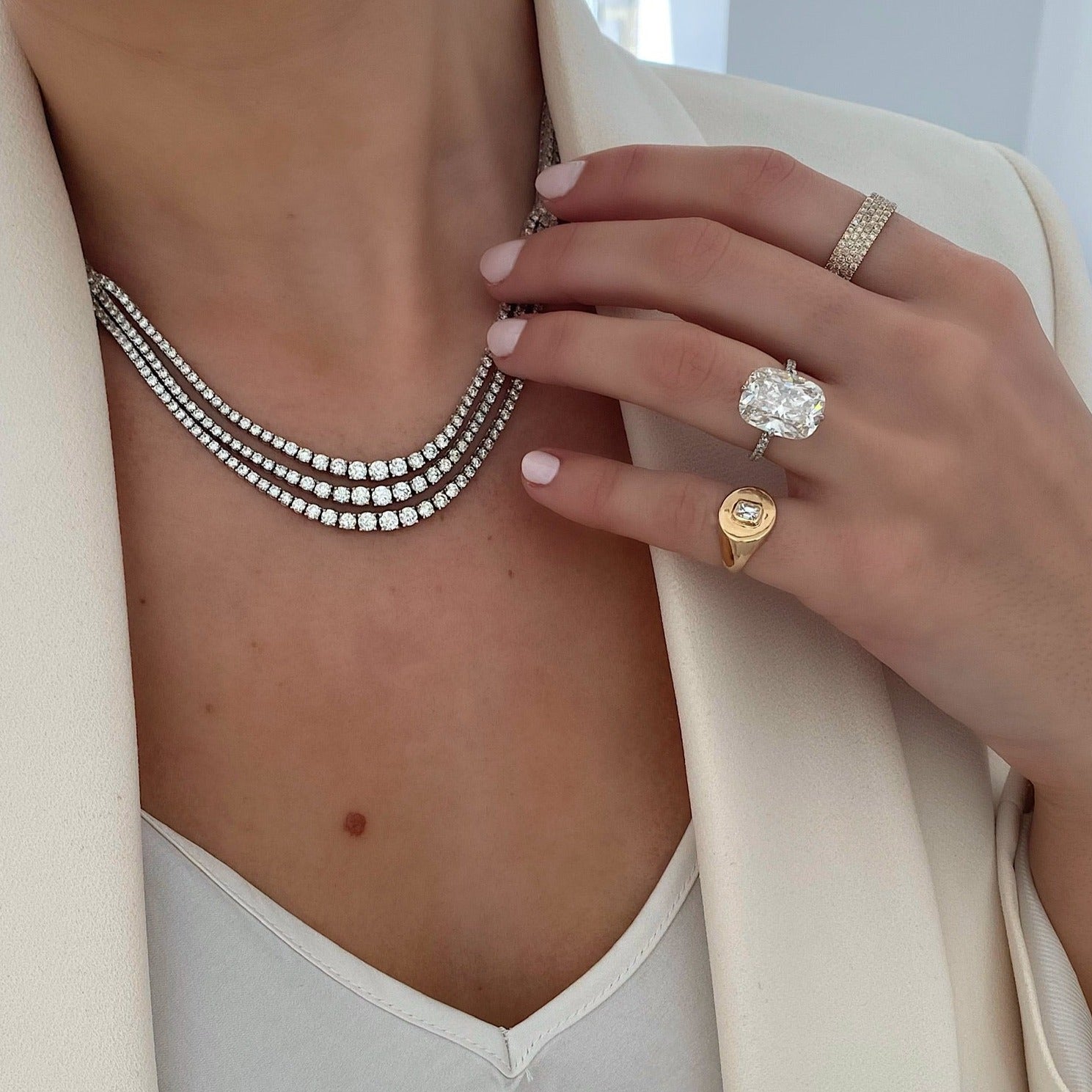 Ring Concierge Necklaces 14k White Gold Triple Row Graduated Diamond Necklace - on-model, model wearing white tank and white blazer. model's hand with engagement ring and fine jewelry