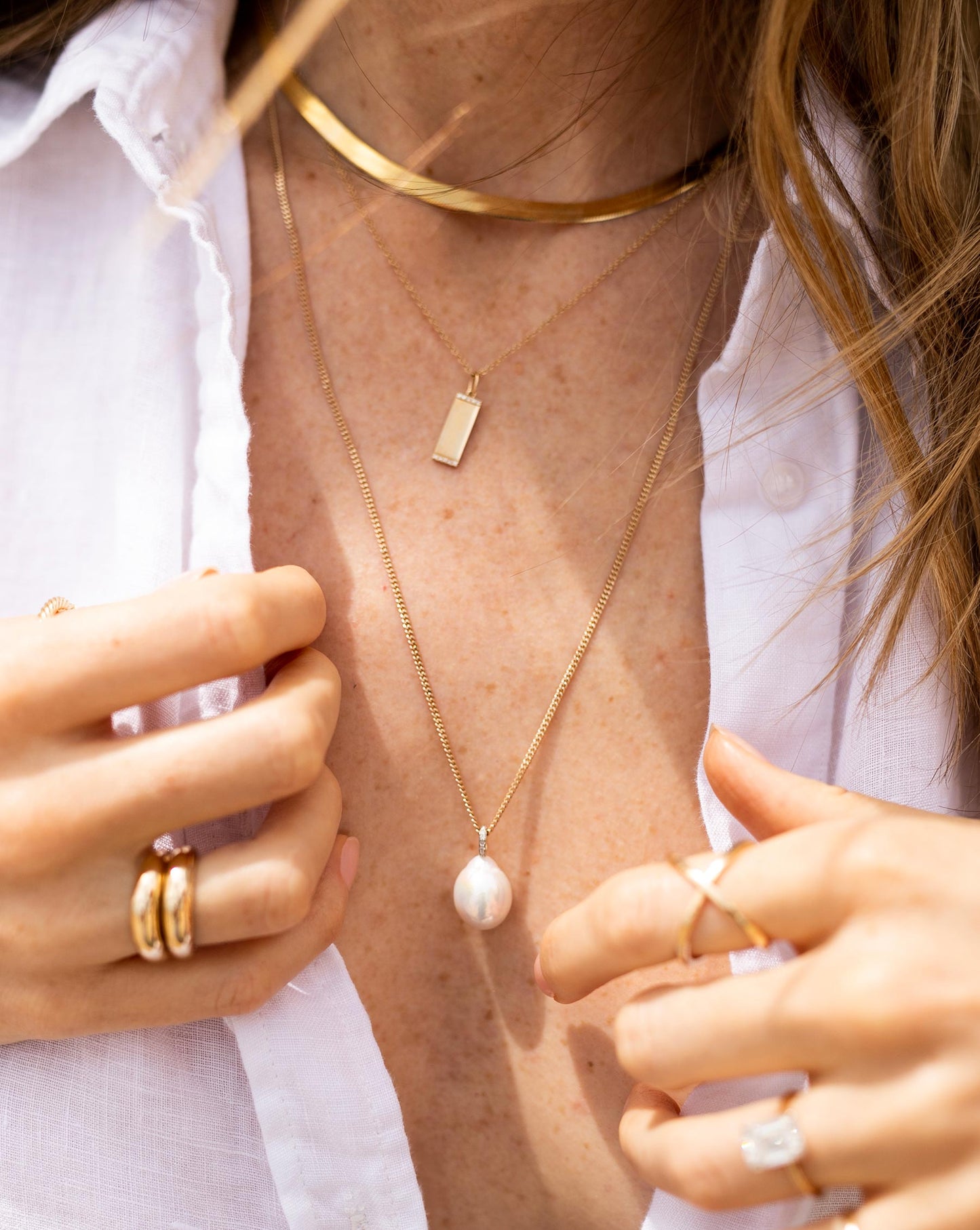 Ring Concierge Necklaces Long Organic Pearl Drop Necklace on 14K Yellow Gold chain - on model in white button-down top