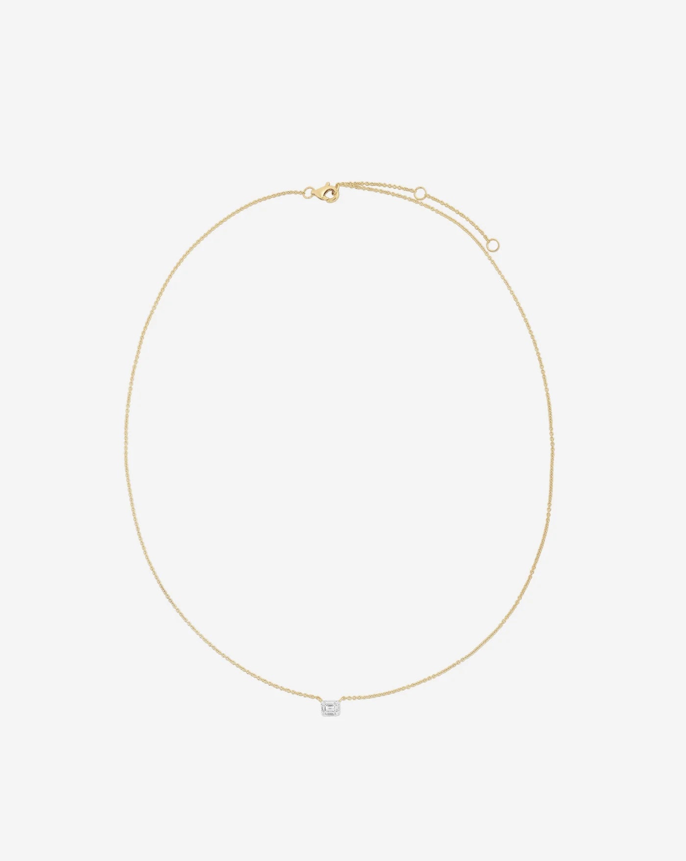 Petite Emerald Illusion product still in Yellow Gold bird's eye angle showing clasp