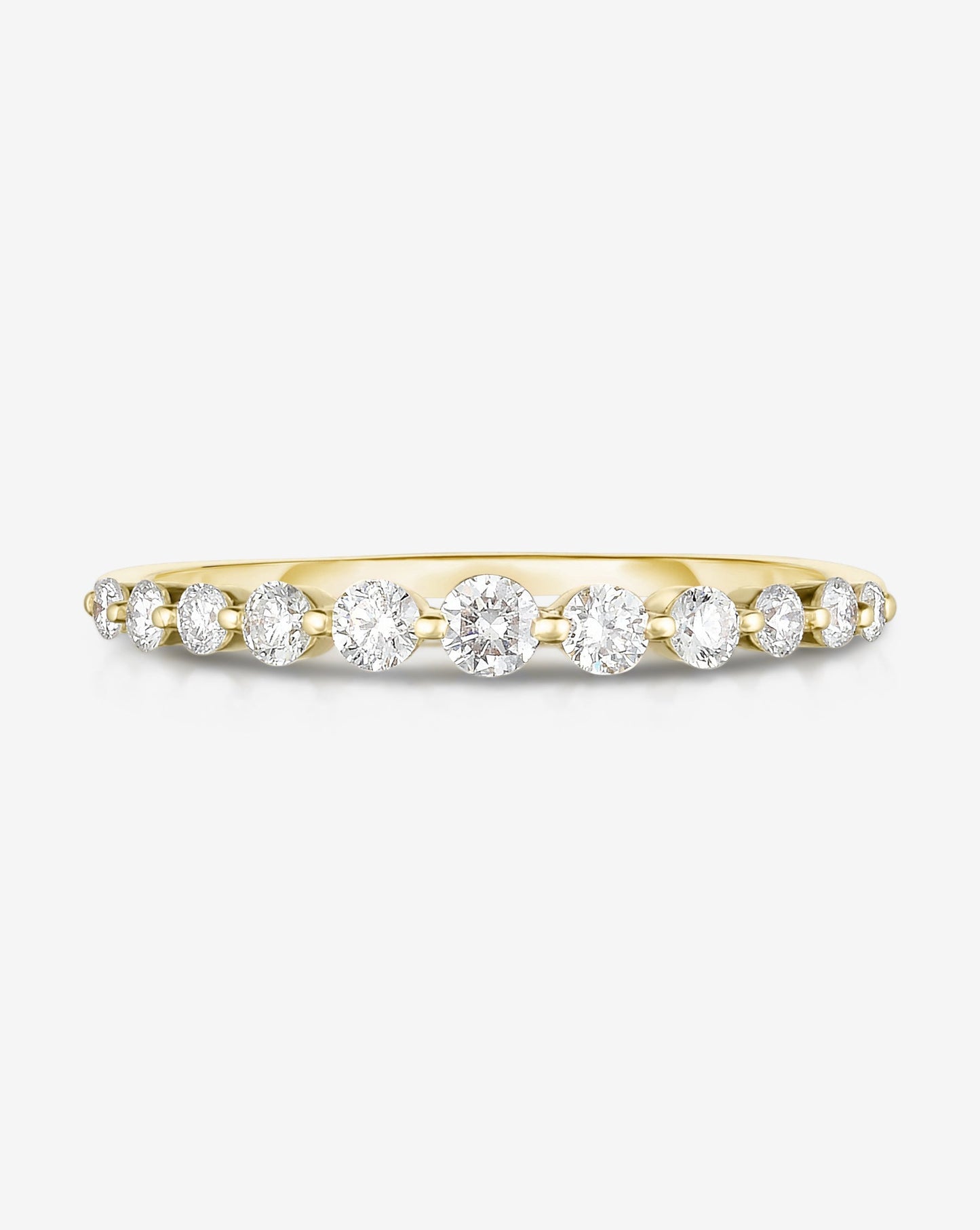 Flat lay of Ring Concierge 14k Yellow Gold / 4.5 Graduated Single Prong Diamond Ring