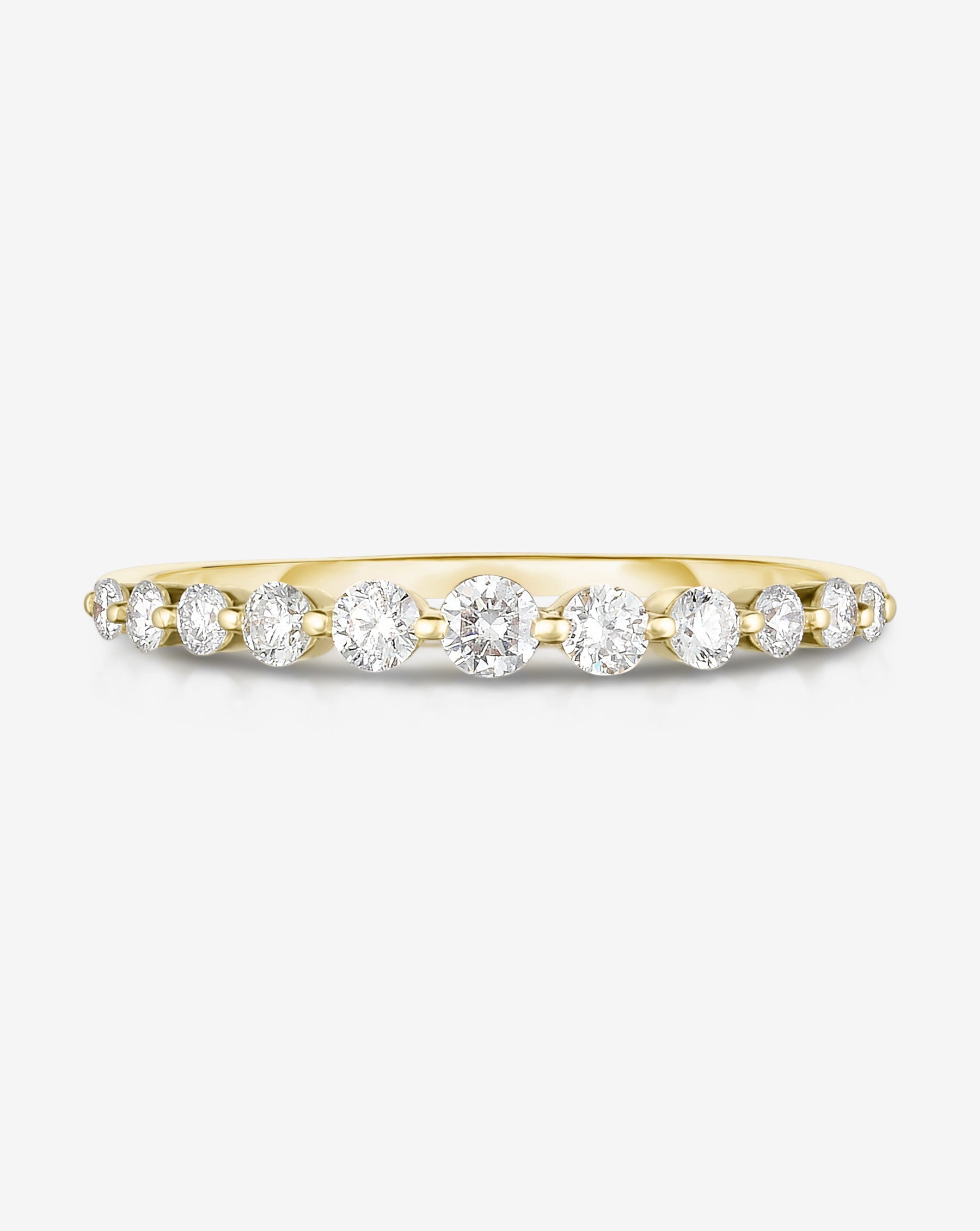 Flat lay of Ring Concierge 14k Yellow Gold / 4.5 Graduated Single Prong Diamond Ring