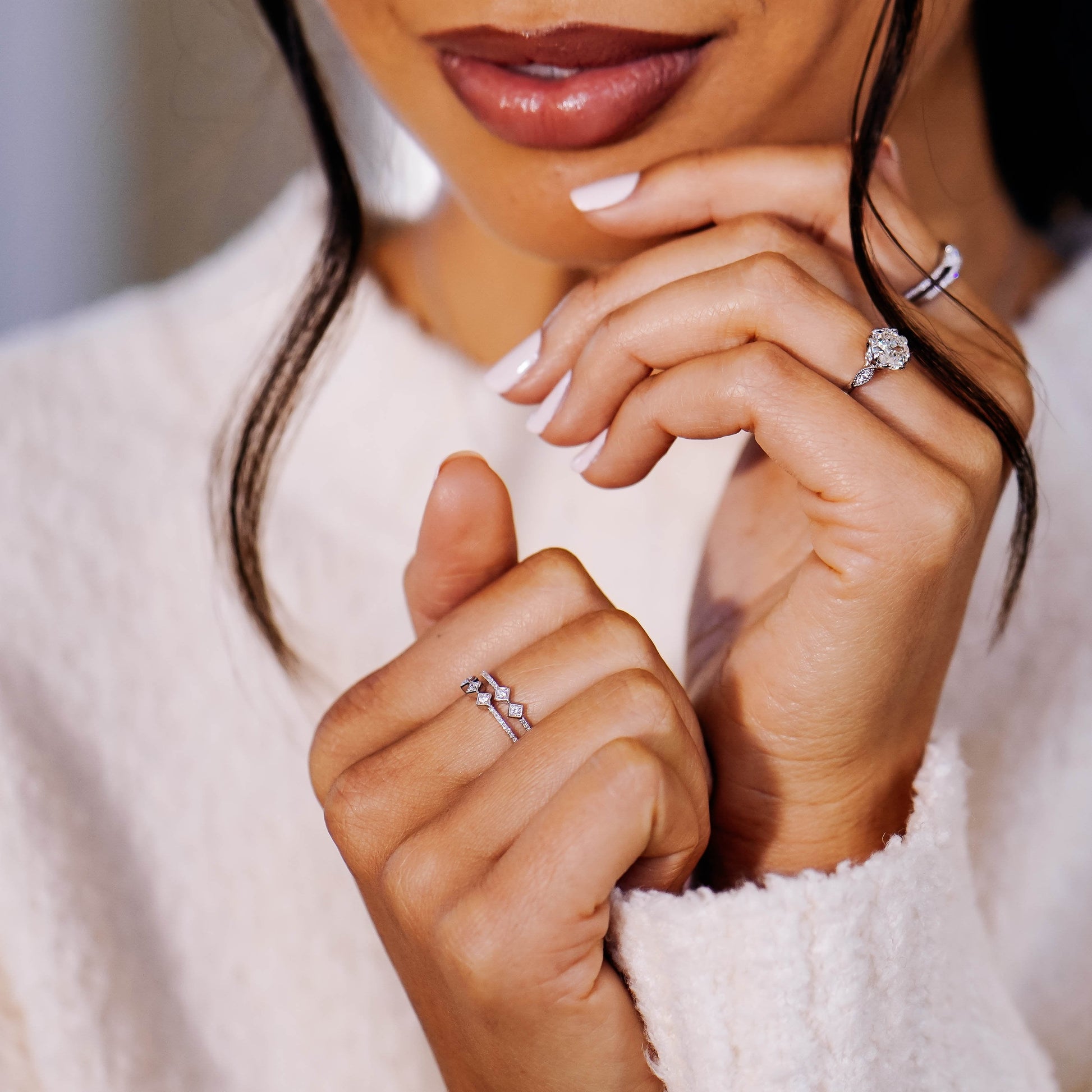Ring Concierge 14k Yellow Gold / 5 Asymmetrical Stacked Diamond Ring - on model on middle finger and styled with model's other hand wearing engagement ring, model wearing white sweater