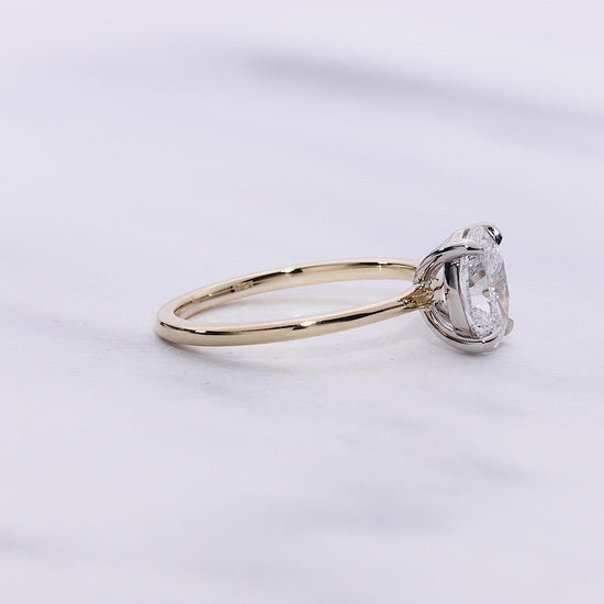 Madison VOW by Ring Concierge oval solitaire engagement ring in yellow gold. 