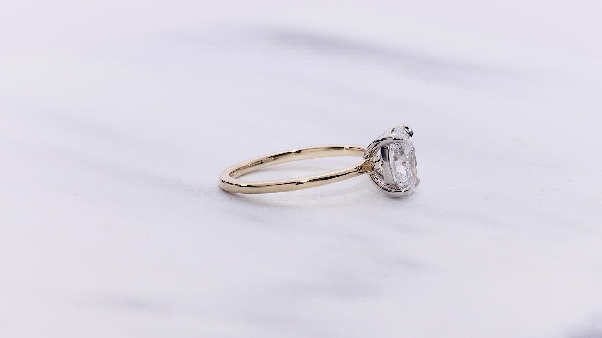 Madison VOW by Ring Concierge oval solitaire engagement ring in yellow gold. 